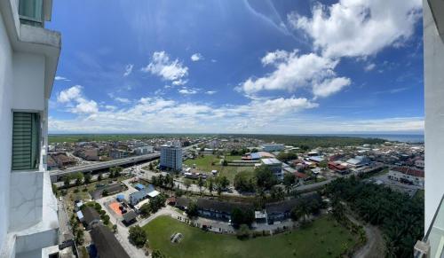 an aerial view of a city with a park at Countryside Penthouse @ One Residence Sekinchan in Sekincan