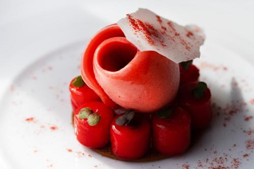 a dessert with a piece of cheese and strawberries at Cap d'Antibes Beach Hotel in Juan-les-Pins