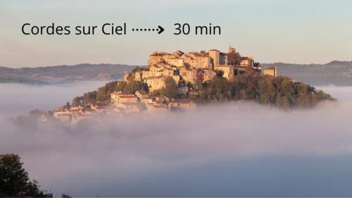 an island in the middle of a sea of fog at Appartement la Toscanelle - Quartier historique - Gaillac in Gaillac