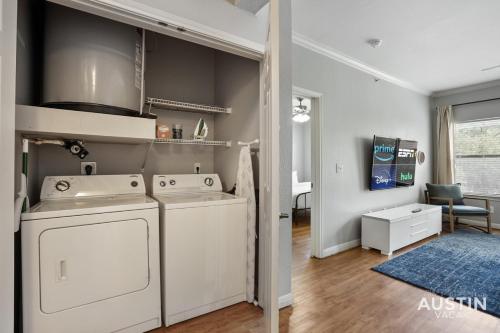 a laundry room with a washer and dryer at Charming and Spacious Apt in Austin with a Pool in Austin