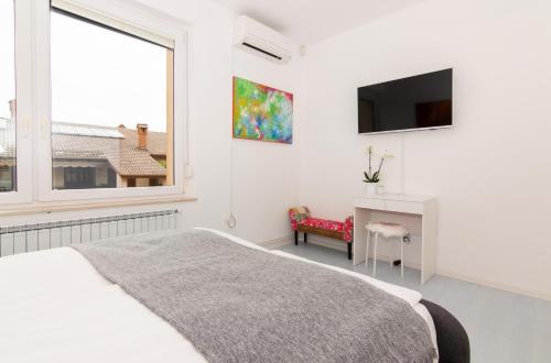 Postel nebo postele na pokoji v ubytování Strawberry Hill Apartment Izola by Locap Group
