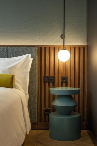 Postel nebo postele na pokoji v ubytování Renaissance Porto Lapa Hotel