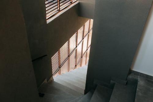 a stairway with a window in a building at Lux Studio near Center in Heraklio Town