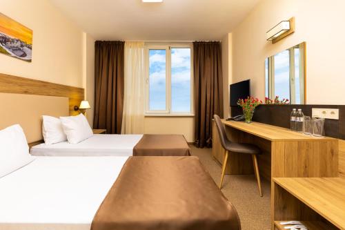 Ένα ή περισσότερα κρεβάτια σε δωμάτιο στο Hotel Intelcoop