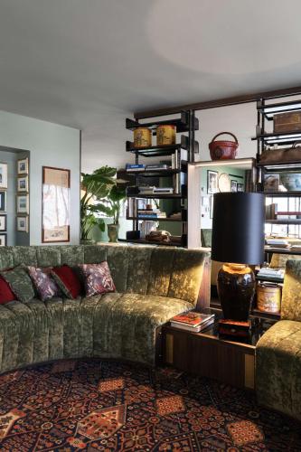 a living room with a couch and a table at Radisson Collection Hotel, Santa Sofia Milan in Milan