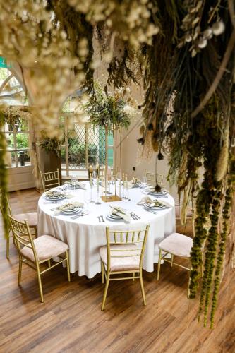 a dining room with a white table and chairs at Abbey Court in Nenagh