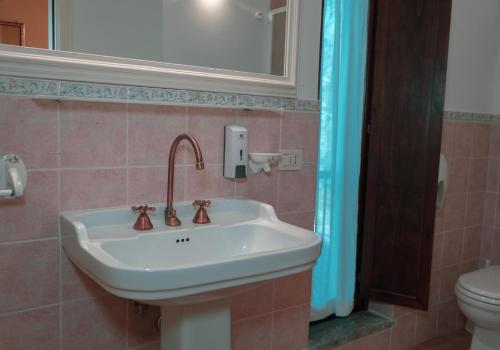 Um banheiro em Carpediem Assisi Living Club
