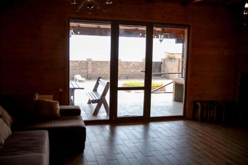 a living room with a door open to a patio at Villa SeaZone in Zatoka
