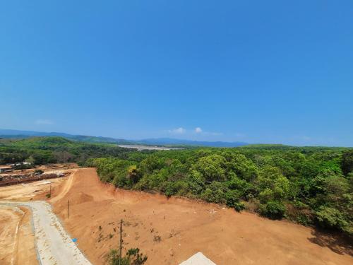 an aerial view of a dirt road in a forest at Hotel Golden Heights Gokarna in Gokarna