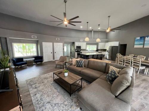 a living room with a couch and a dining room at Spacious 4 bedroom with 2 baths with Pool and boat dock in Crystal River