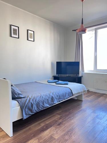 En eller flere senge i et værelse på CityView Apartment