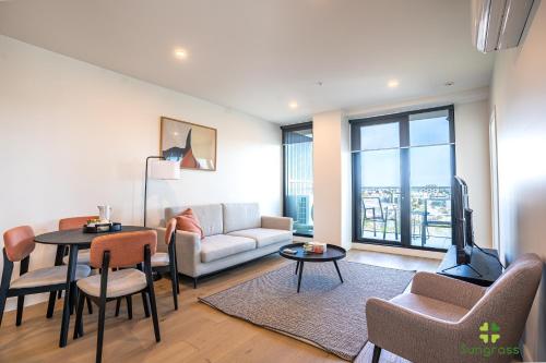 a living room with a couch and a table at Liberty One in Melbourne