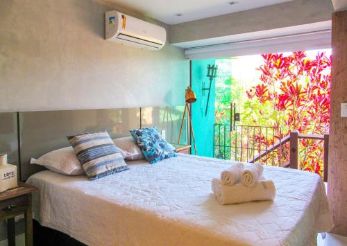 Postel nebo postele na pokoji v ubytování Lindo loft com piscina e vista p mar em Buzios RJ