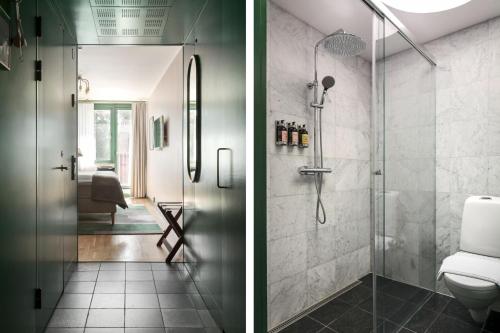 a bathroom with a shower and a toilet at Villa Källhagen in Stockholm