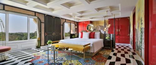 a bedroom with a white bed and red cabinets at Taj Mahal, New Delhi in New Delhi