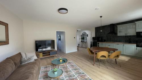 a living room with a couch and a table at Malis-Ferienhaus in Bad Harzburg