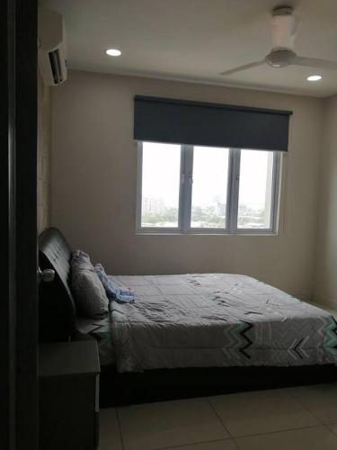 Ένα ή περισσότερα κρεβάτια σε δωμάτιο στο Aurora Residence @ PUCHONG PRIMA