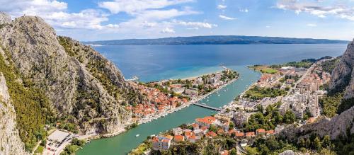 an aerial view of a town next to a body of water at New! Charming Villa Perina with private heated pool in Tugare