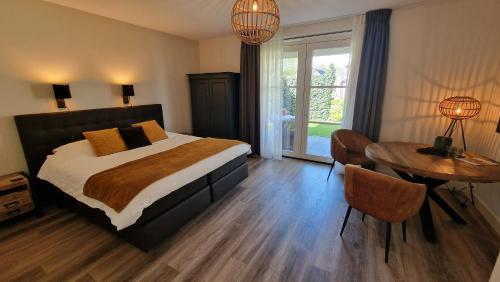 Postel nebo postele na pokoji v ubytování B&B De Droomhoeve