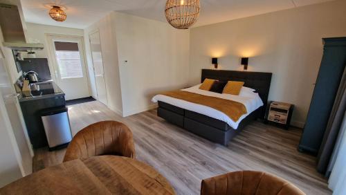 Postel nebo postele na pokoji v ubytování B&B De Droomhoeve