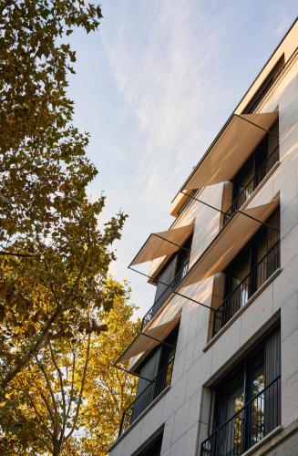 a building with balconies on the side of it at EmiLu Design Hotel in Stuttgart