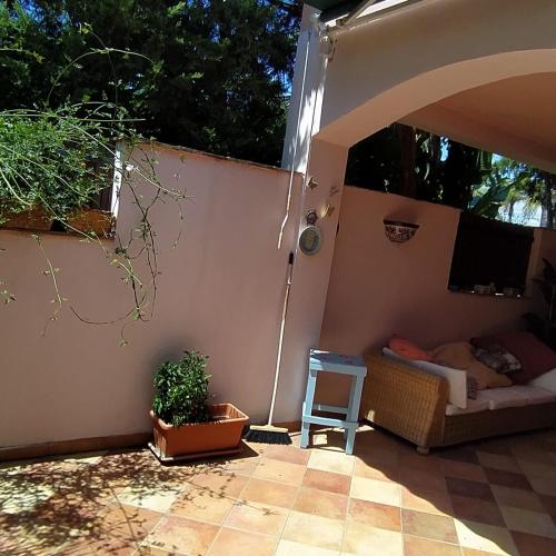 a patio with a couch and a table at Casa Mariella in Agrigento