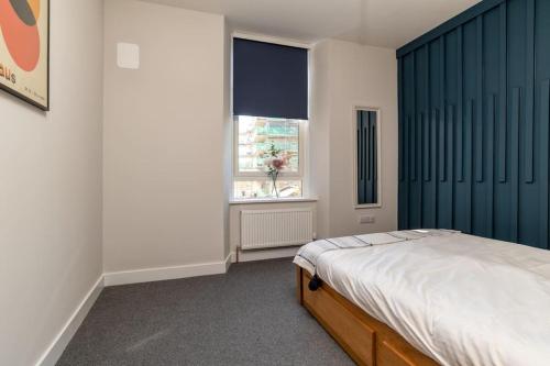 a bedroom with a bed and a window at * City Centre * Unique Space * in Aberdeen