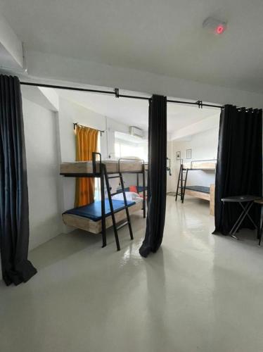 a room with two bunk beds in a room at IM Santai Lodge in Kangar