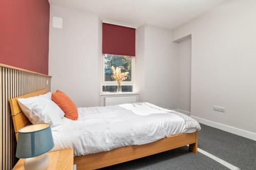 a bedroom with a bed and a window at Heart of Aberdeen * Ground Floor in Aberdeen
