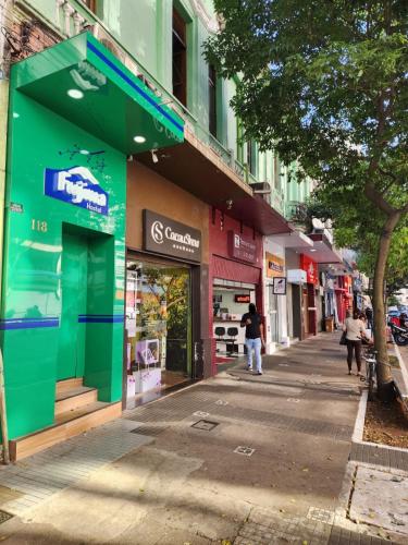 a street with shops on the side of a building at Fujima Hostel in Sao Paulo