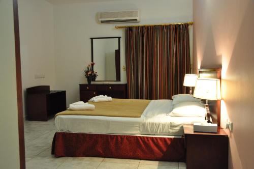 Lova arba lovos apgyvendinimo įstaigoje Sahara Hotel Apartments