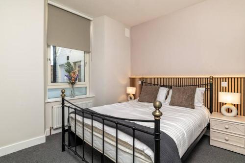a bedroom with a bed and a window at * Ground Floor * The Grove * in Aberdeen