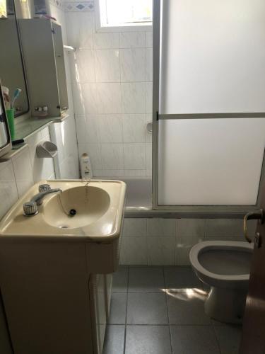 a bathroom with a sink and a toilet at Aire ju in Bahía Blanca