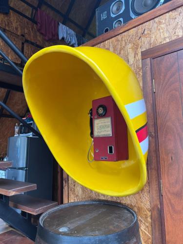 a yellow apparatus on the side of a wall at Mirador Bosque Gran Torino Neusa in Cogua