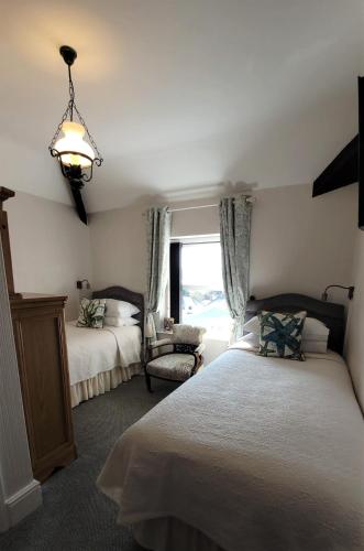 Katil atau katil-katil dalam bilik di Greylands Guest House