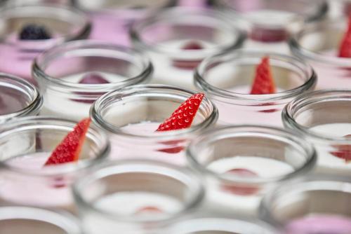 a group of glass cups with strawberries in them at MLL Blue Bay in Palma de Mallorca