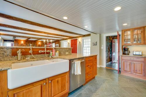 a large kitchen with wooden cabinets and a white sink at Marlboro Escape 9 Mi to Mount Snow Resort! 