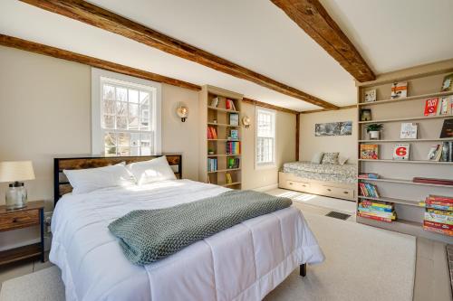 a bedroom with a large white bed and book shelves at Marlboro Escape 9 Mi to Mount Snow Resort! 