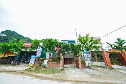 a street with signs on the side of the road at Phong Nha Magic Fingers Homestay and Spa in Phong Nha