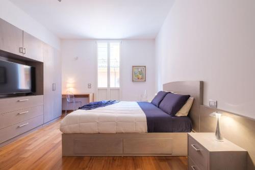 Postel nebo postele na pokoji v ubytování D'Azeglio & Galluzzi Suites