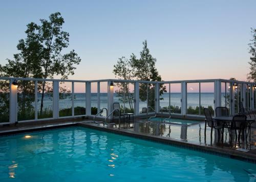 a swimming pool with a view of the water at Bluefin Bay on Lake Superior in Tofte