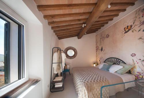 Ένα ή περισσότερα κρεβάτια σε δωμάτιο στο Agriturismo La Via Dell'Oliviera
