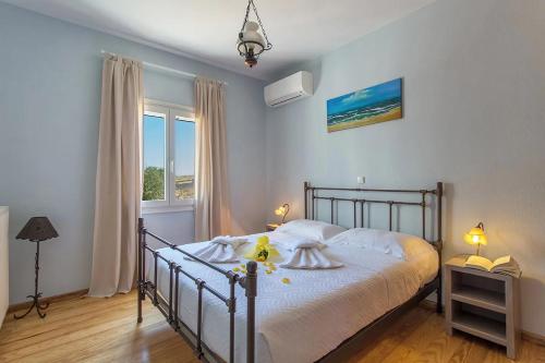 A bed or beds in a room at SAIL VILLA