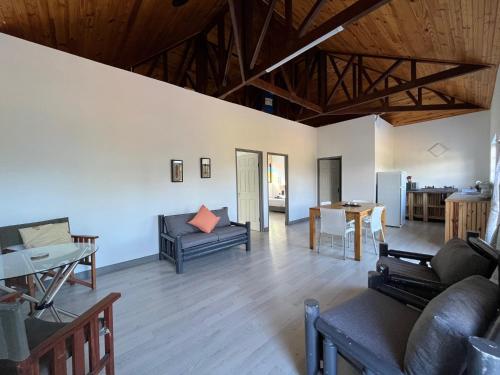 a living room with a couch and a table at Forest Gate Estate in Plettenberg Bay