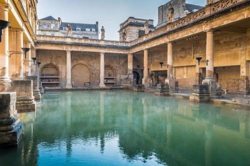 a pool of water inside of a building at Brand new Georgian flat in Bath in Bath