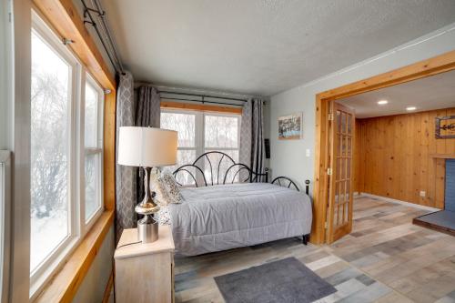 a bedroom with a bed and a large window at Inviting Missouri River Vacation Rental 2 Mi Away in Great Falls