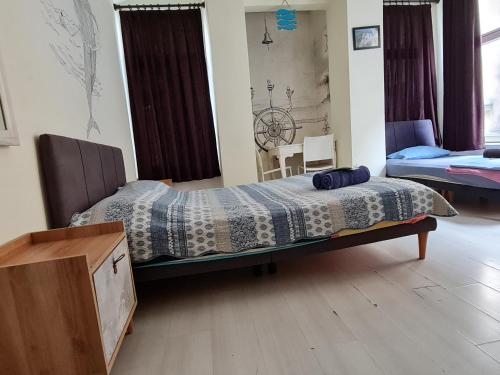 a bedroom with a bed with a quilt on it at TAXİM HOSTEL in Istanbul