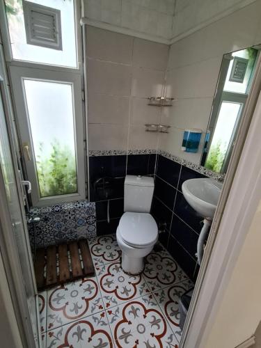 a bathroom with a toilet and a sink at TAXİM HOSTEL in Istanbul