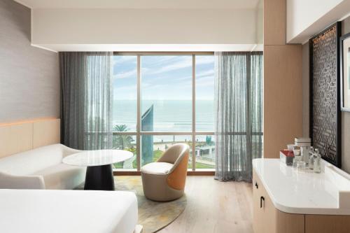 a living room with a view of the ocean at JW Marriott Hotel Lima in Lima