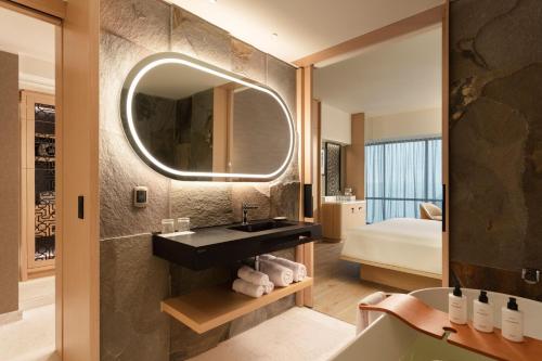 a bathroom with a sink and a mirror at JW Marriott Hotel Lima in Lima
